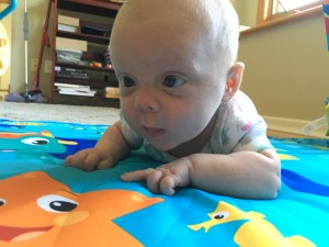 Emily is getting so good at tummy time! Caught her first real major head lift on camera somehow. Wow!