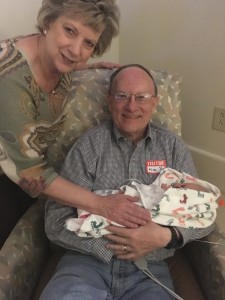 Grandma and Grandpa are so so happy to be holding their first granddaughter!