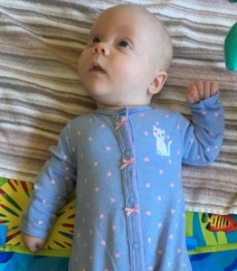 Emily is already bustin buttons on one of her newborn outfits!